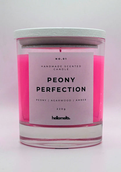 Peony Perfection 220g candle, with lid on, by Hellomelts, exuding delicate peony, luxurious agarwood, and warm amber aromas, in a beautiful bright pink wax.