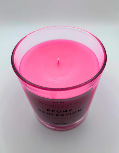 Peony Perfection 220g candle, showing top of jar with lid off, by Hellomelts, exuding delicate peony, luxurious agarwood, and warm amber aromas, in a beautiful bright pink wax.