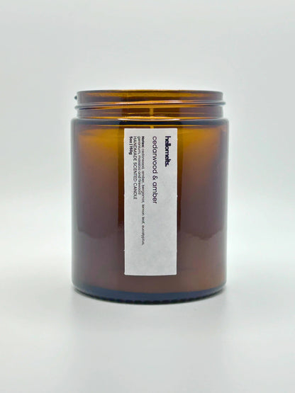 Front view of Cedarwood & Amber candle by Hellomelts with the lid off, showing the hand-poured wax, from the autumn collection.